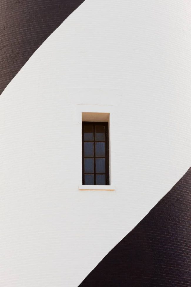 Small narrow window architectural abstract of Cape Hatteras Lighthouse tower of Outer Banks Island near Buxton, North Carolina, USA